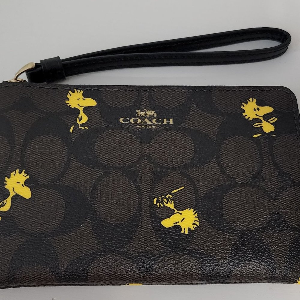 New Coach X Peanuts Corner Zip Wristlet In Signature Canvas With Woodstock Print